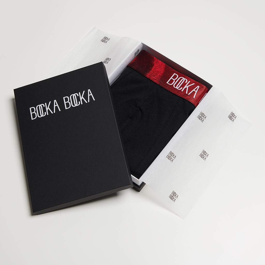 A pair of Bocka Bocka Diavolo Midnight mens designer trunks in a Bocka Bocka gift box
